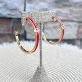 Gold hoop earrings with red enamel detailing and the Georgia Bulldogs "G" logo.