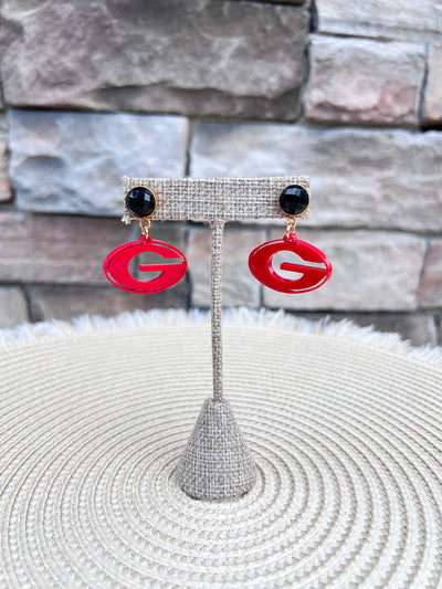 Red Georgia Bulldogs "G" logo drop earrings with black faceted studs and gold-tone hardware.