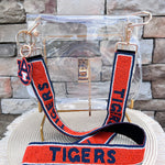 Orange hand-beaded handbag strap with navy "TIGERS" lettering and gold-tone clasp hardware.