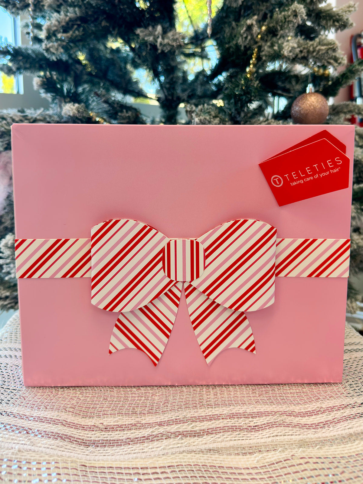 TELETIES Advent Calendar featuring 12 holiday surprises including hair clips and nylon hair ties.
