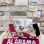 Alabama Crimson Tide hand-beaded bag strap with crimson beading, white "ALABAMA" lettering, and gold swivel clasps for clear stadium bags and handbags.