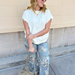 Ivory short-sleeve knit top with subtle tonal criss-cross texture