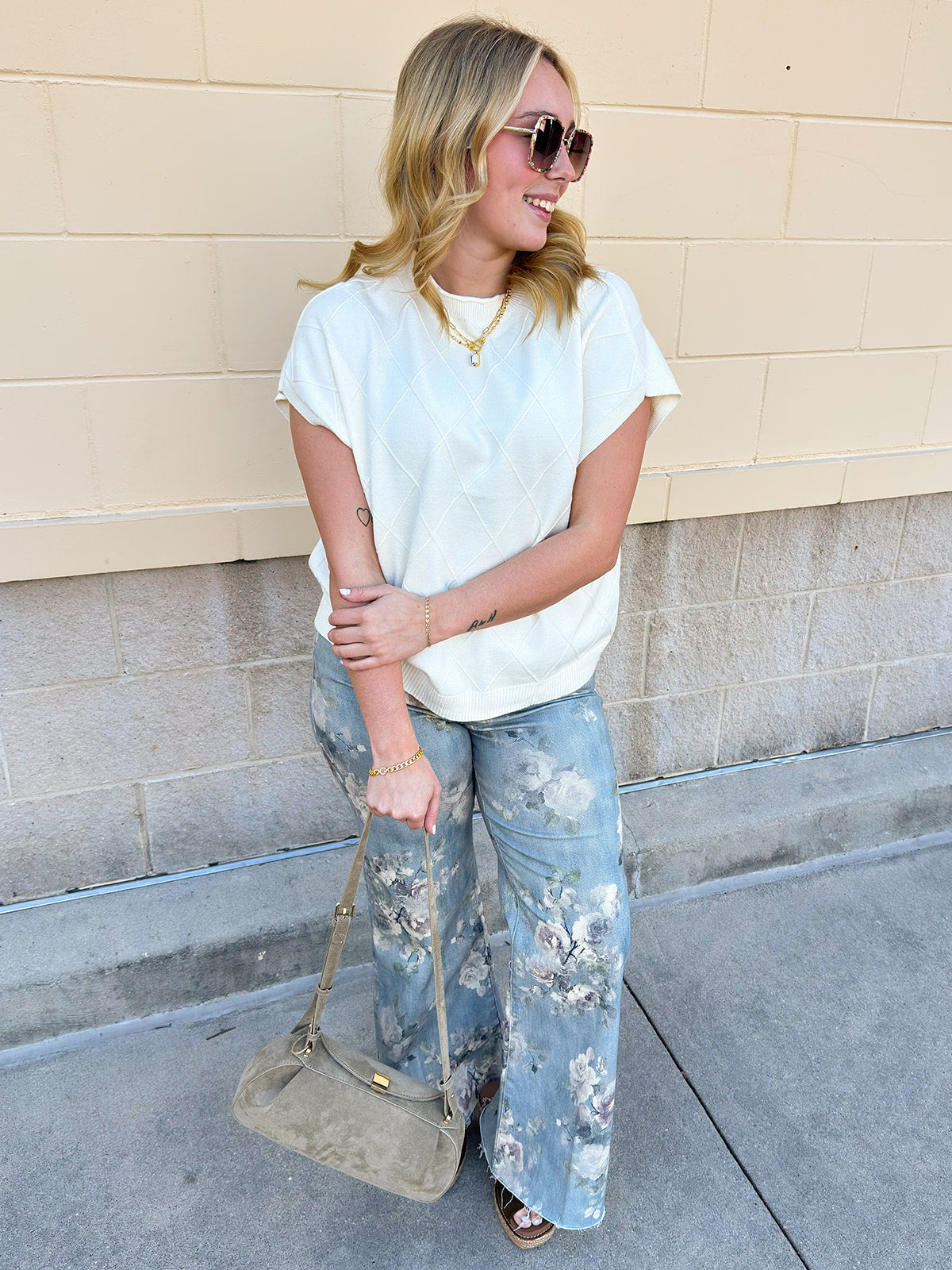 Ivory short-sleeve knit top with subtle tonal criss-cross texture