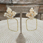 Gold hoop earrings with large pearl flower stud, designed by Taylor Shaye.