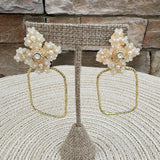 Gold hoop earrings with large pearl flower stud, designed by Taylor Shaye.