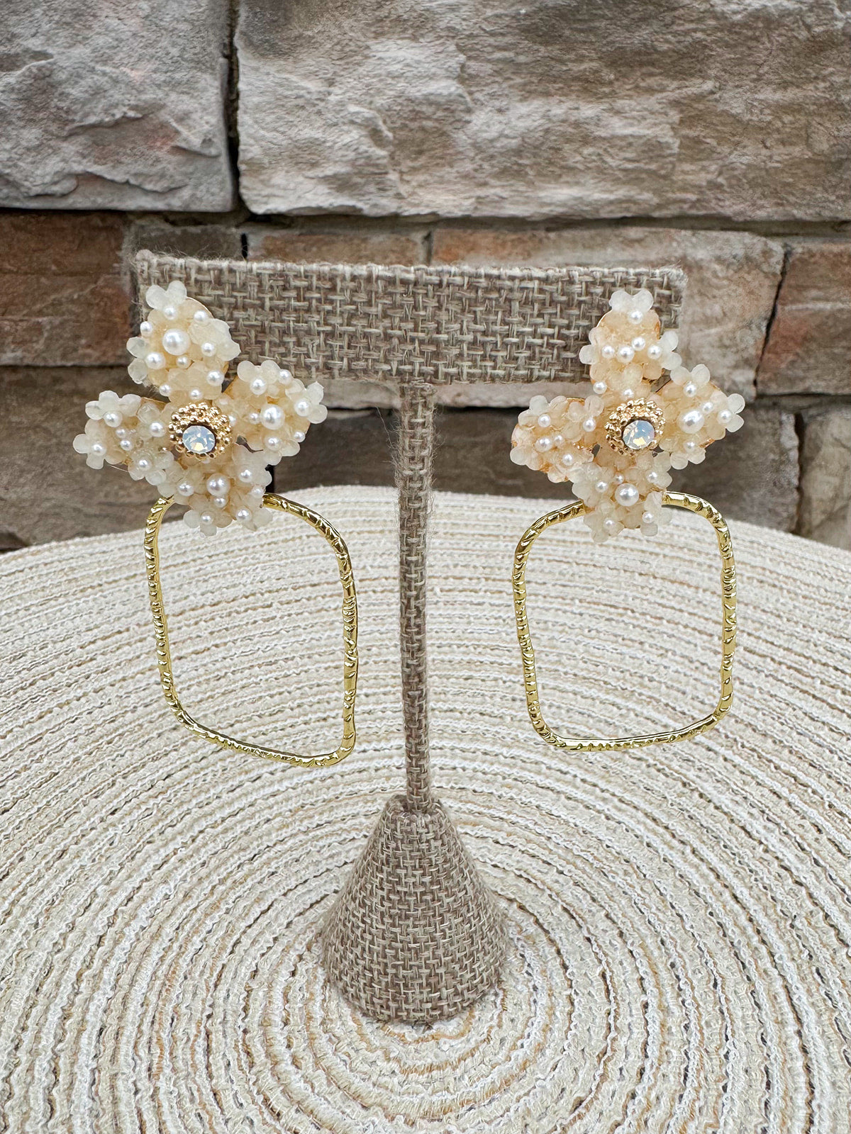 Gold hoop earrings with large pearl flower stud, designed by Taylor Shaye.