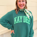 Green Kappa Delta sorority mock neck sweatshirt with collegiate-inspired details and a cozy feminine silhouette.