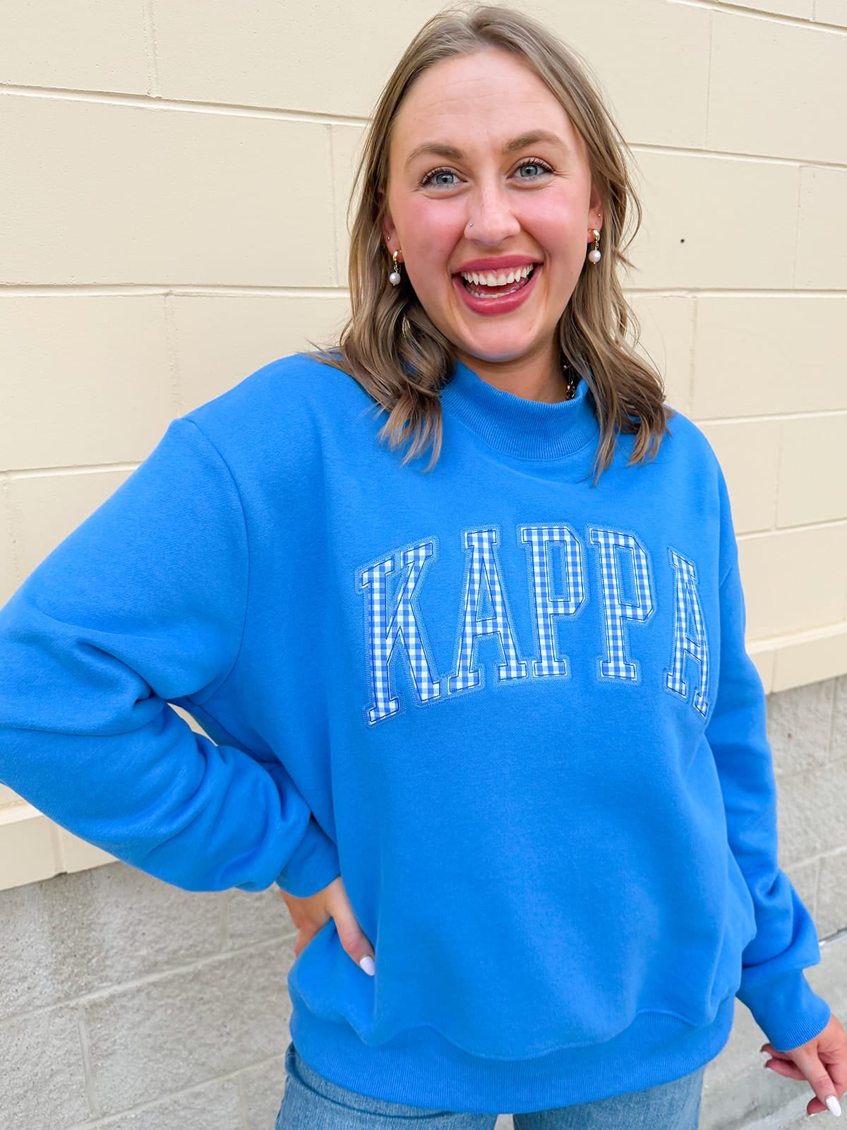 Kappa Kappa Gamma sorority mock neck sweatshirt with collegiate-inspired details and a cozy feminine silhouette.