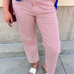 High-rise red and ivory striped wide straight leg pants with a structured twill fabric and raw hem.