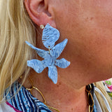 Oversized marbled light blue statement earrings with a glossy finish, displayed in a bold, lightweight design.