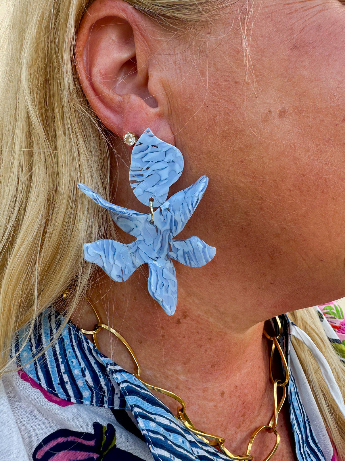 Oversized marbled light blue statement earrings with a glossy finish, displayed in a bold, lightweight design.