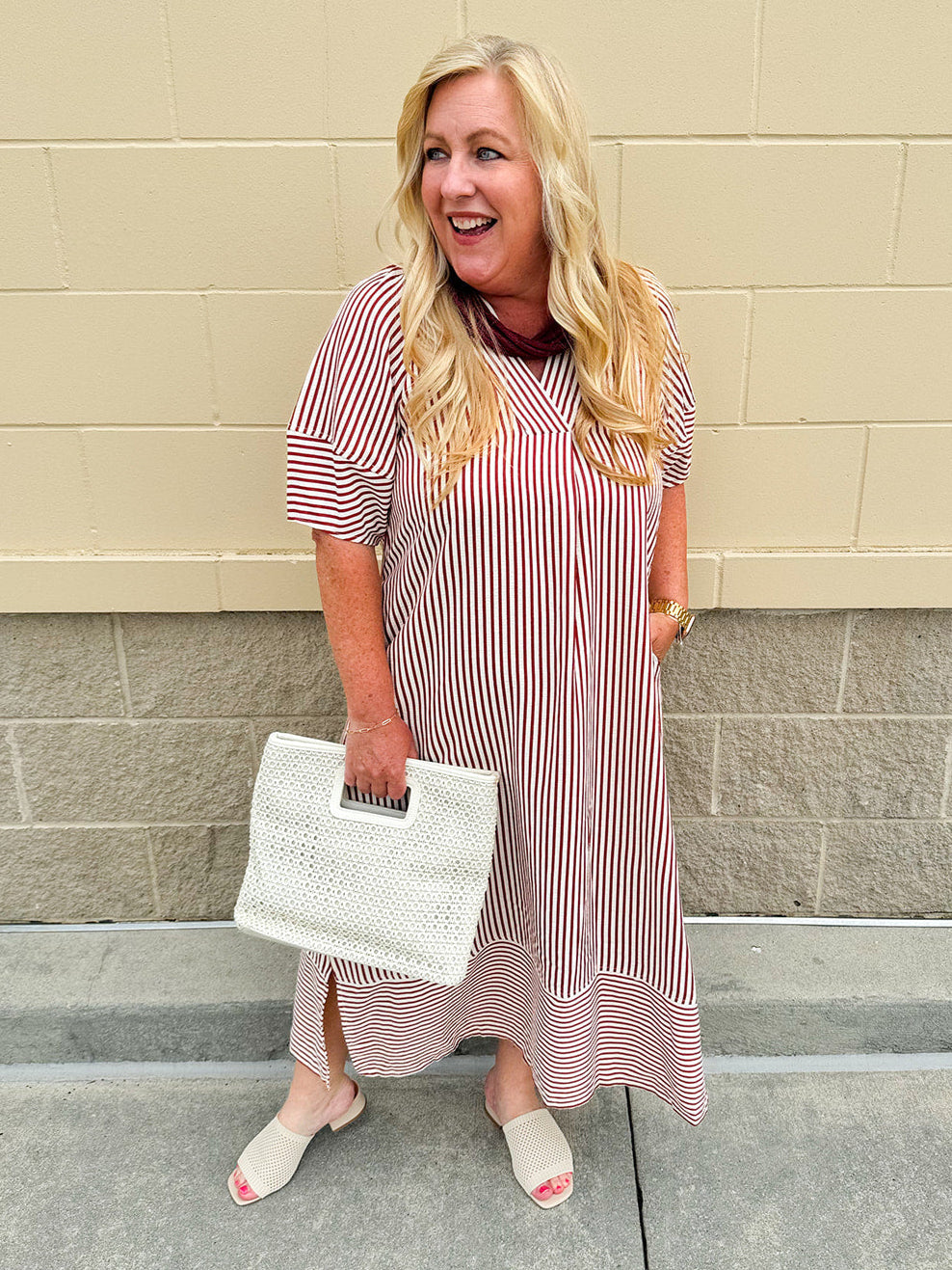 Garnet and cream striped midi dress with lantern sleeves, V-neckline, side slits, and horizontal stripe contrast at hem and sleeve cuffs