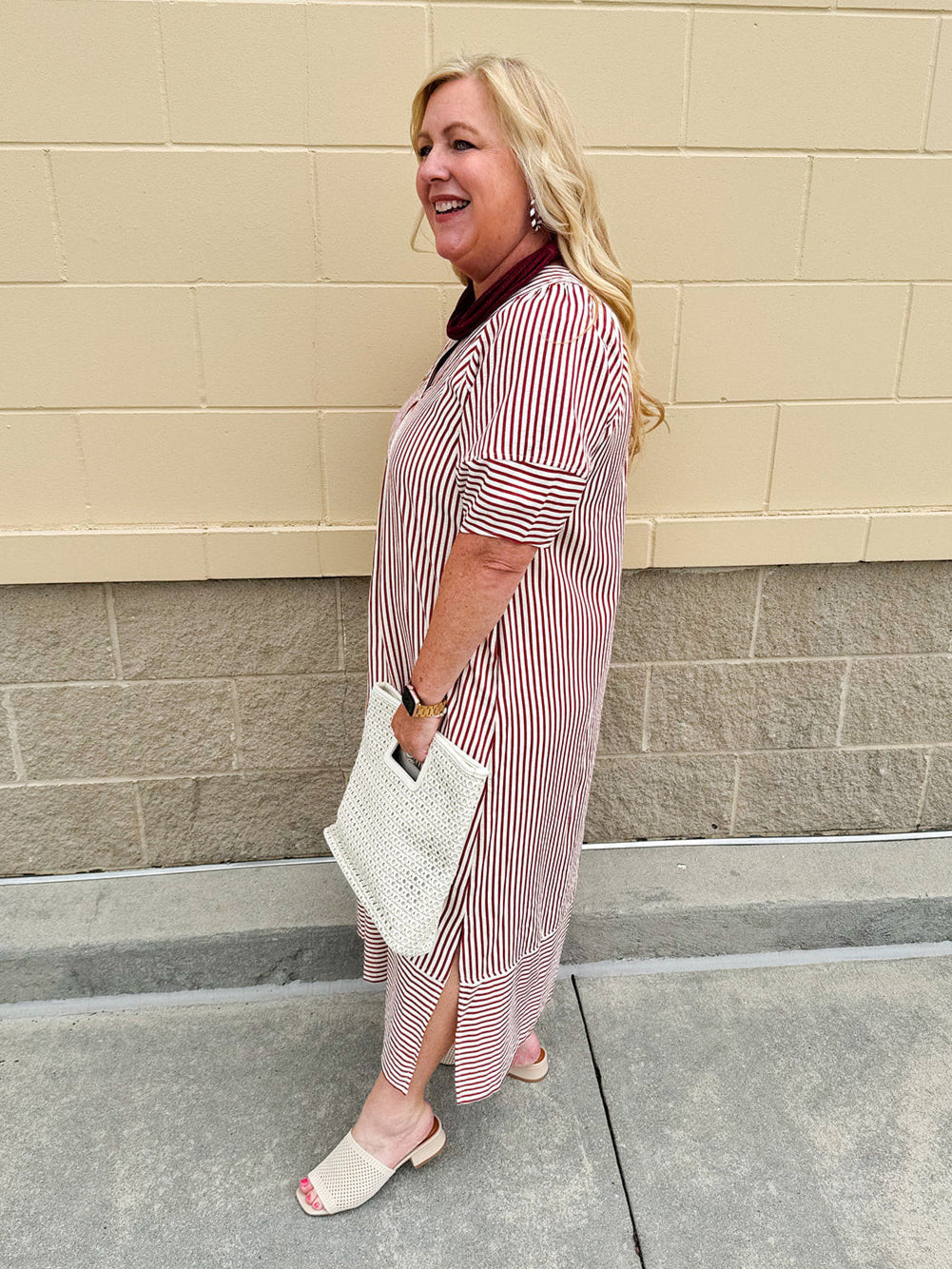 Garnet and cream striped midi dress with lantern sleeves, V-neckline, side slits, and horizontal stripe contrast at hem and sleeve cuffs