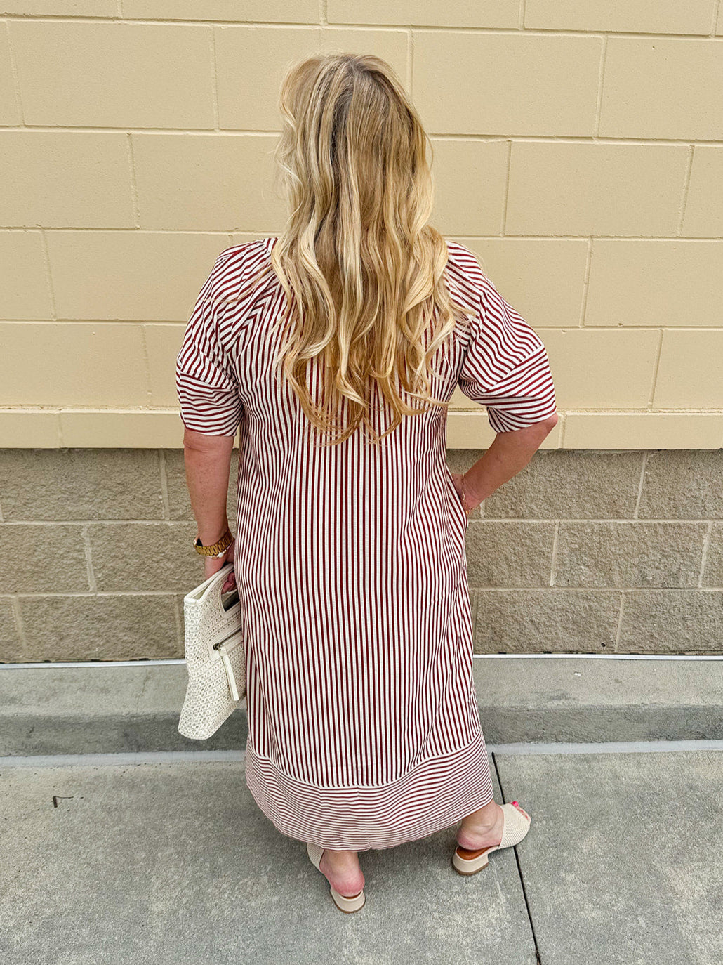 Garnet and cream striped midi dress with lantern sleeves, V-neckline, side slits, and horizontal stripe contrast at hem and sleeve cuffs