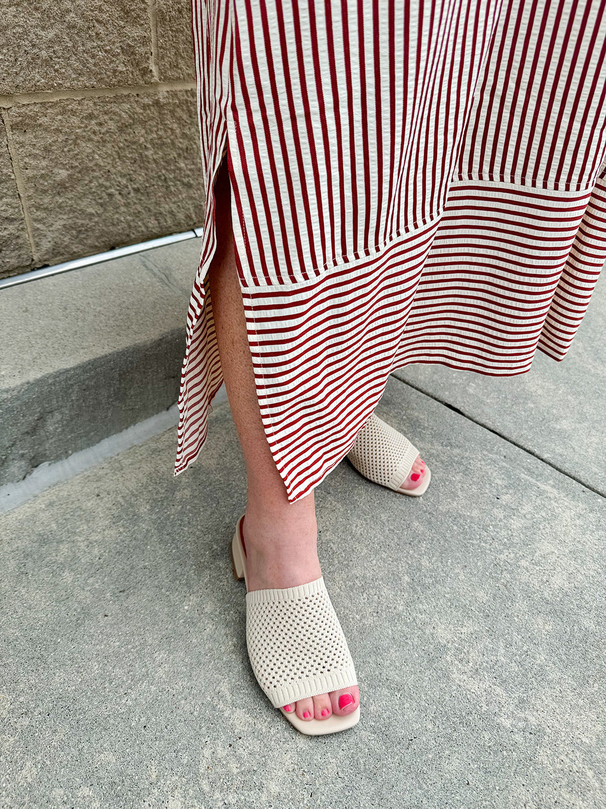 Garnet and cream striped midi dress with lantern sleeves, V-neckline, side slits, and horizontal stripe contrast at hem and sleeve cuffs