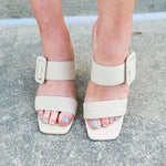 Natural linen-style block heel with square toe, double straps, and oversized buckle detail—stylish and comfortable.