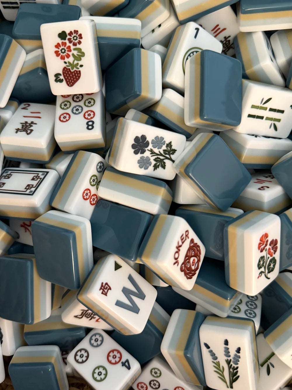 Laken mahjong tile set featuring misty blue, soft sand, white, and deep blue acrylic tiles
