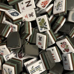 Oakley mahjong tile set featuring bark brown, moss green, and forest green acrylic tiles with a nature-inspired design