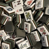 Oakley mahjong tile set featuring bark brown, moss green, and forest green acrylic tiles with a nature-inspired design
