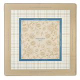 Warm honey mahjong mat with Chinoiserie-inspired peony and bee toile design on a neutral background