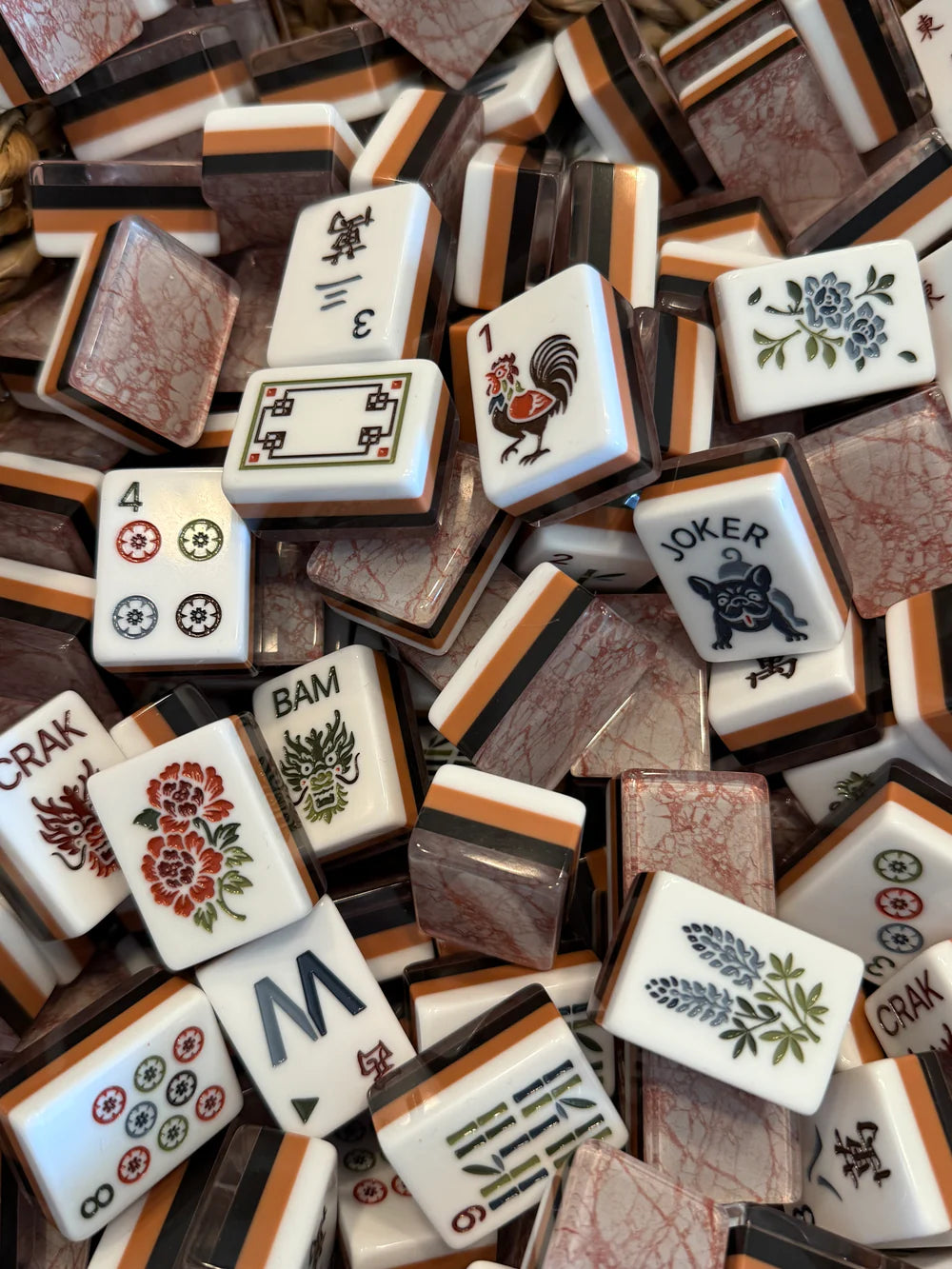 Terracotta marble mahjong tile set featuring warm clay tones and deep espresso acrylic tiles with a natural stone-inspired design