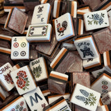 Terracotta marble mahjong tile set featuring warm clay tones and deep espresso acrylic tiles with a natural stone-inspired design