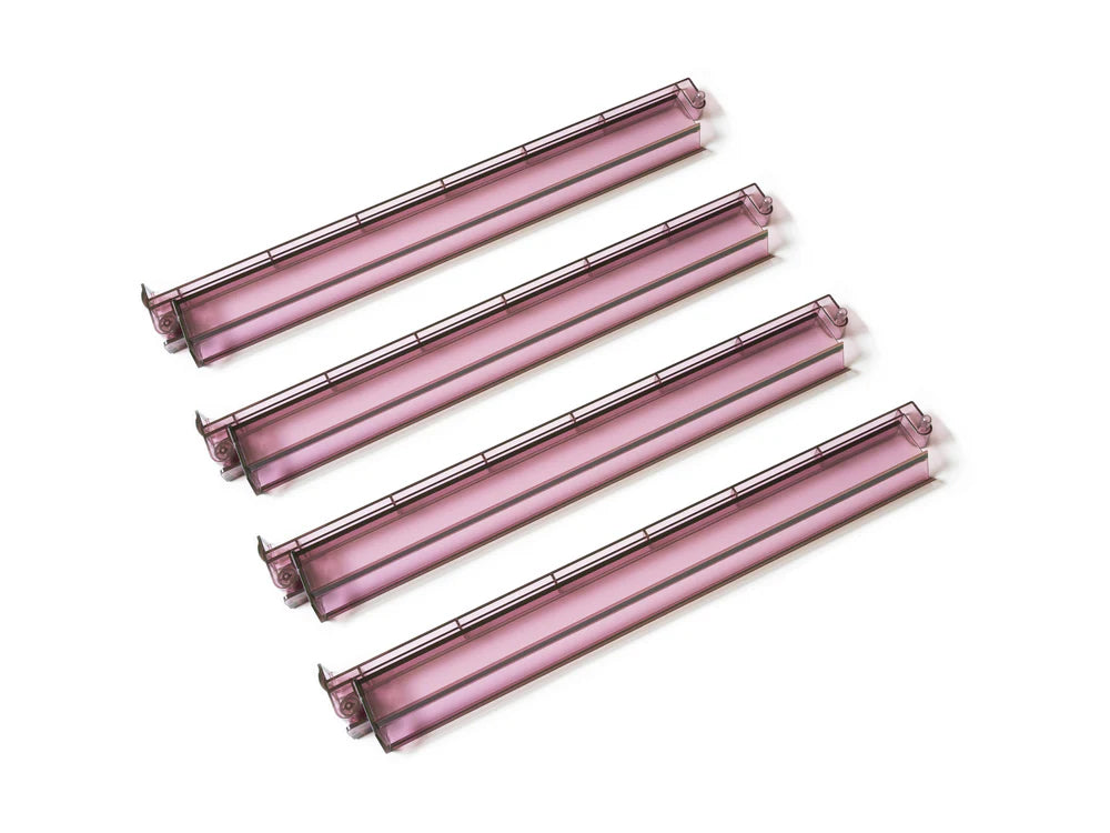 Translucent plum mahjong racks with attached pushers in a smoky purple finish