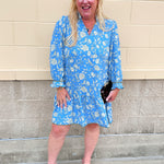 Song Bird Blue mini dress with songbird pattern, ruffle neckline, and button cuffs