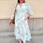 [Mary Square] Riley Midi Dress | Lacecap White  with white background, green botanical floral pattern, long sleeves, and five-button neckline