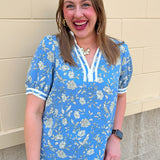 Song Bird Blue short sleeve blouse with white floral print and contrast trim