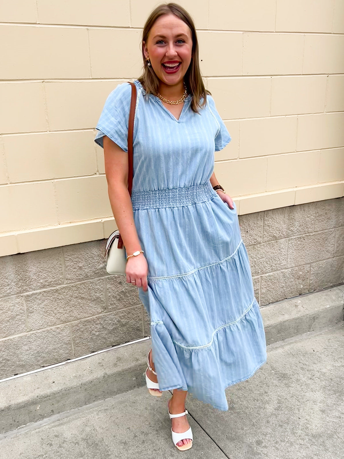 Blue striped midi dress with flutter sleeves and smocked waist