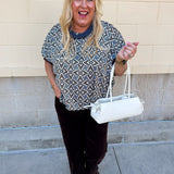 Mosaic Daydream blouse with a blue, brown, and white geometric print