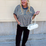 Mosaic Daydream blouse with a blue, brown, and white geometric print