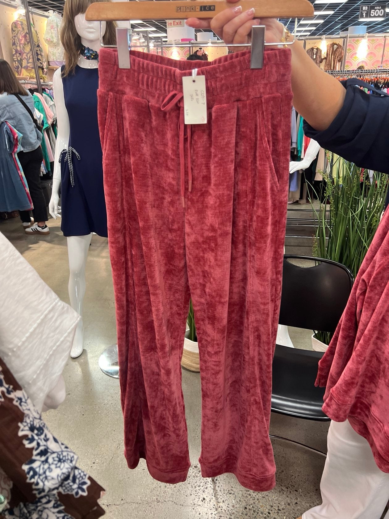 Ruby red knit matching set featuring wide leg drawstring pants and raglan sleeve crew neck top.
