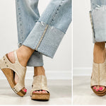 Light gold raffia cork wedges with gold rivets, Velcro heel strap, and a cushioned footbed