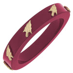 Garnet resin bangle with gold FSU logo charm on a white background