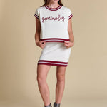 White varsity-inspired cap-sleeve sweater top with garnet detailing and rope embroidery reading “Seminoles”