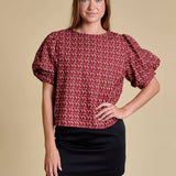 Puff-sleeve blouse with FSU-inspired all-over print featuring “FSU,” “Go Noles,” Florida outline, and spear imagery