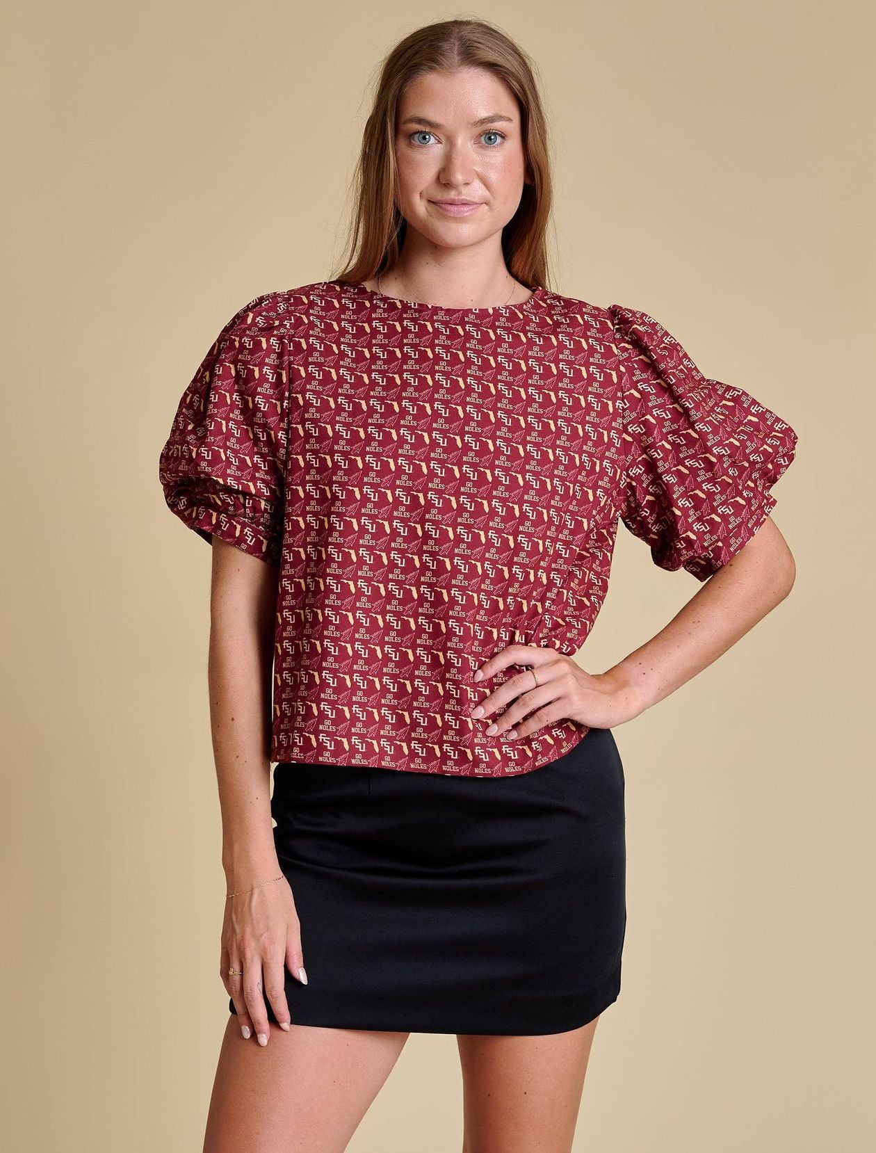 Puff-sleeve blouse with FSU-inspired all-over print featuring “FSU,” “Go Noles,” Florida outline, and spear imagery