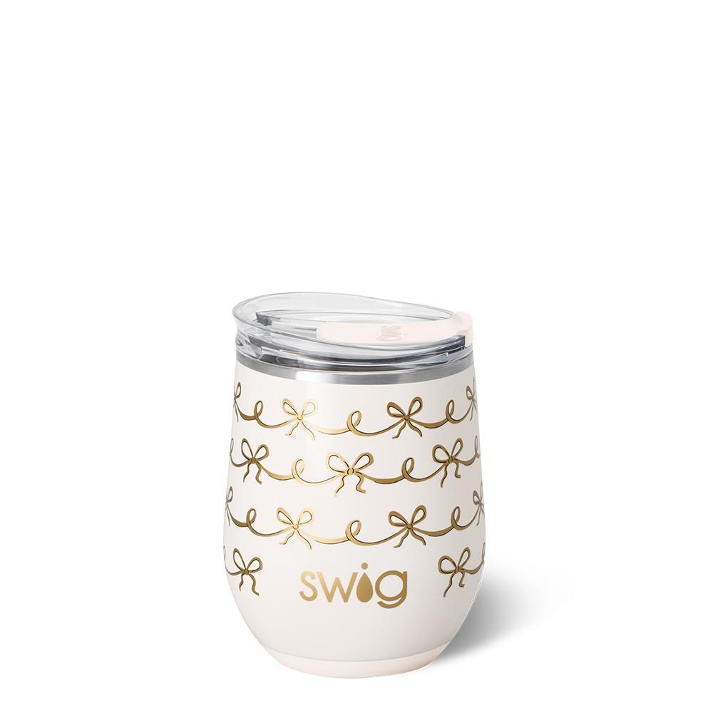 12oz insulated stemless wine cup with ivory background and gold metallic bow design.