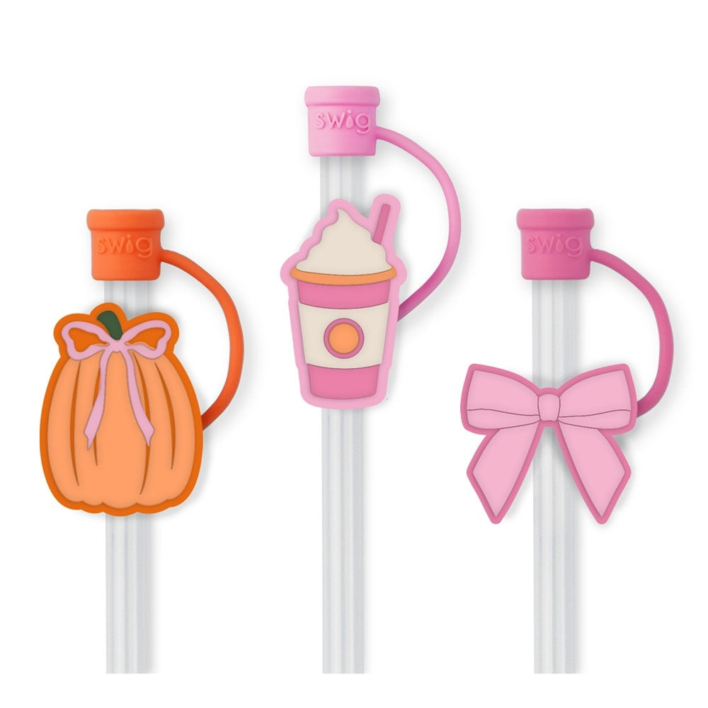 Set of three reusable straws with whimsical silicone pumpkin-and-bow toppers, each with a protective cap.