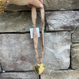 Tan scarf-style necklace with hammered gold heart pendant, handmade by Hart Designs.