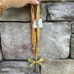 Camel scarf-style necklace with gold metal dragonfly pendant, handmade by Hart Designs.