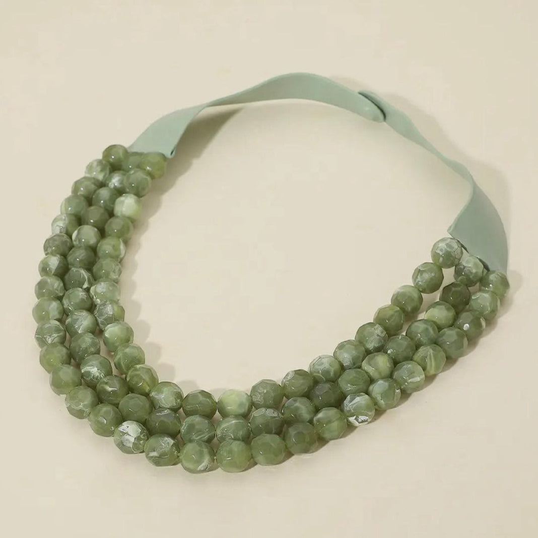 Olive chunky triple-layer bead necklace with faux leather cords and matching magnetic clasp.