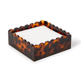 Tortoise print acrylic napkin holder featuring scalloped edges and a classic decorative design for holding cocktail napkins or guest towels.