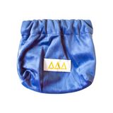 Light blue Delta Delta Delta mini coin purse featuring embroidered ΔΔΔ Greek letters on the front.