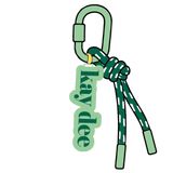 Kappa Delta sorority keychain featuring lowercase "kay dee" lettering with dark green rope detailing and a sage green carabiner clip.