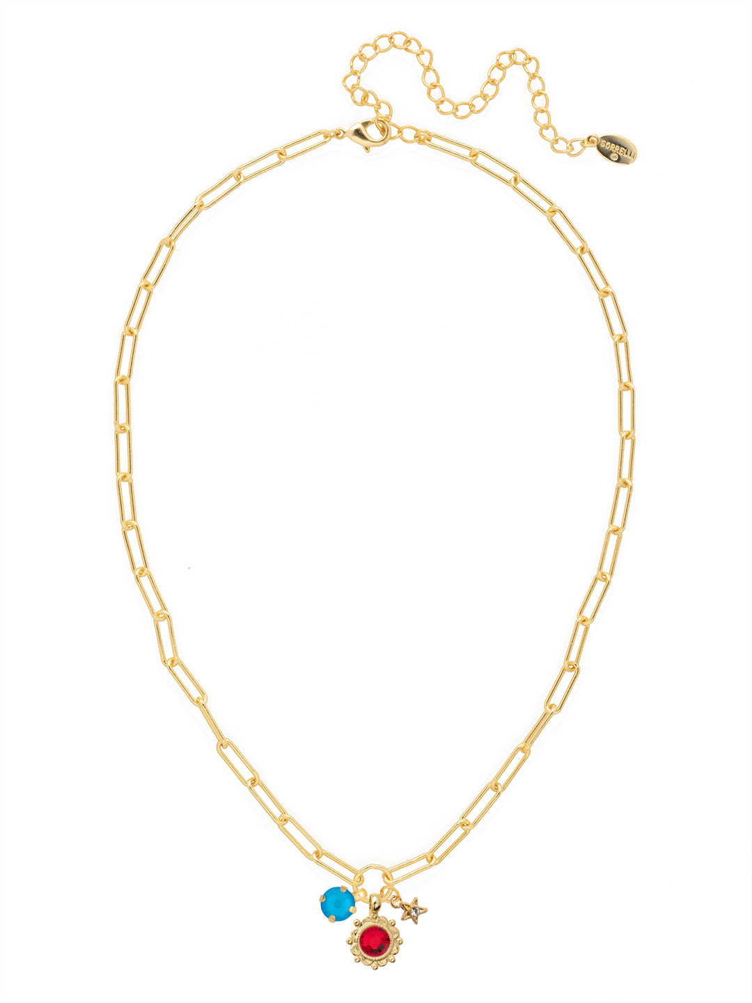 Gold-tone necklace with three crystal-accented charms—a star, a flower, and a round-cut stone—on a paperclip chain