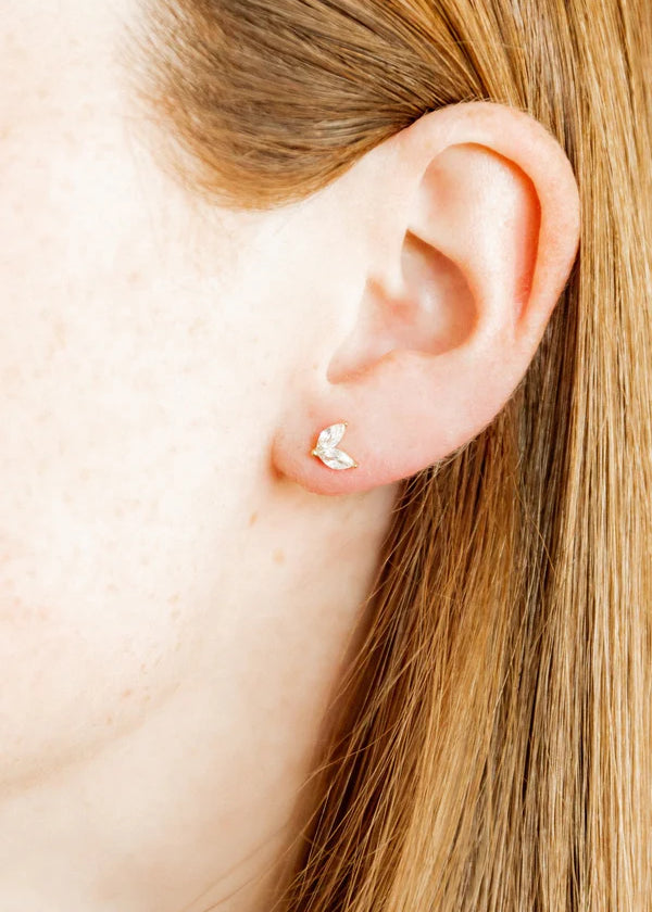 Close-up of Nova Stud Earrings showcasing sparkling CZ stones in a minimalist 7mm design