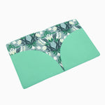 Mint cruelty-free leather mahjong card folio with coordinating printed interior, designed to hold NMJL and IMC mahjong cards.